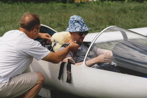 Pilots getting ready for the flight on glider airplane Stock Photos
