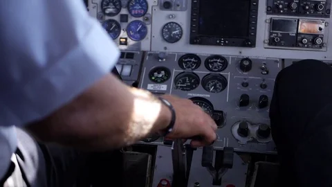 The pilot's hands in a cabin of the plane. Stock Footage 77451411