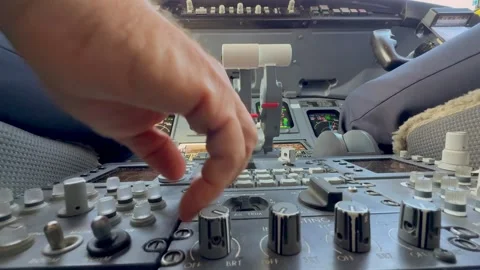 Pilots Hands Completing the Routine Pre-flight Checks in a Modern Jet Cockpit Stock Footage 333545786