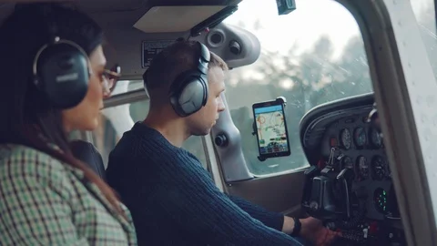 Pilots inside the aircraft preparing for flight. Stock Footage 125709442