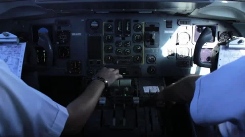 Pilots operating controls of a plane during the flight. Video stock 53227649