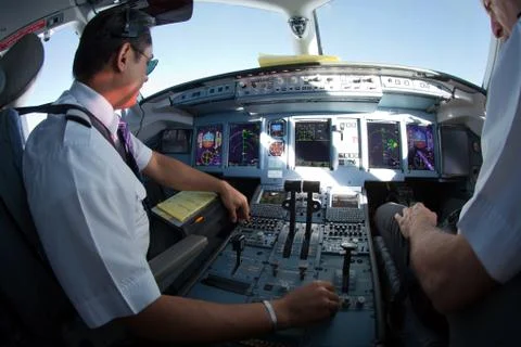 The pilots of the passenger plane at work Stock Photos