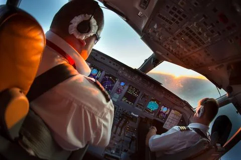 The pilots of the passenger plane at work Stock Photos