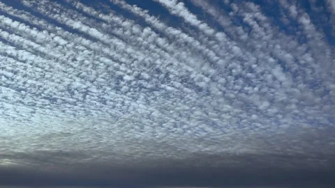 Pilot’s Perspective of Altocumulus Undulatus Clouds in a Blue Sky at Sunset Stock Footage 340335033
