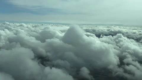 A Pilot’s Perspective in a Flight Over Cottony Storm Clouds: An Aerial Footage Stock Footage 304336737