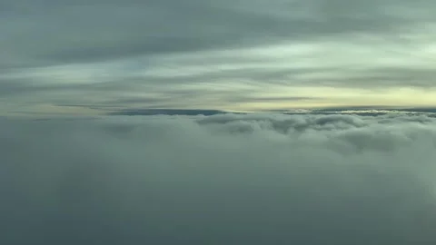 A Pilot’s Perspective: Flying Over an Endless Sea of Clouds at Dawn. An Stock Footage 304510079