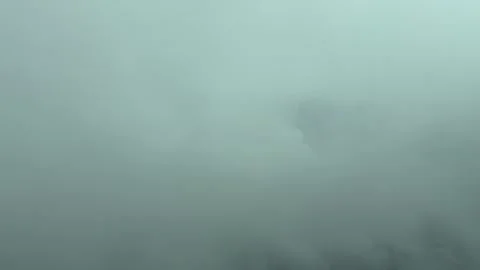 A Pilot’s Perspective: Flying Through a Dramatic Stormy Sky, Emerging From the Stock Footage 304488785