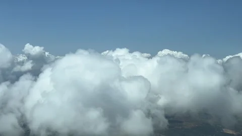 A pilot’s perspective: flying through a tiny cumulus cloud in a hot summer Stock Footage 244761545