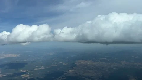 A pilot’s point of view, aerial view of some tiny cumulus clouds recorded Stock Footage 241877208
