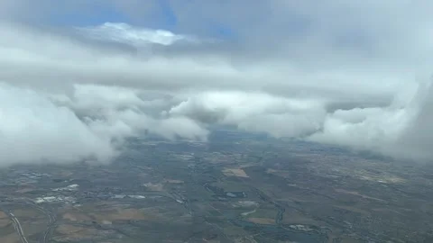 A pilot’s point of view shot from a jet’s cabin flying though some clouds Stock Footage 241882375