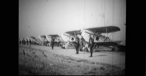 Pilots standing in front of their biplanes Stock Footage