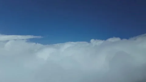 A Pilot’s View: Breaking Through The Clouds in a Blue Sky. Aerial Footage Taken Stock Footage 305037651