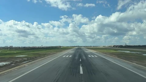 A Pilot’s View in a Real Time Landing with the Runway Surroended by Water Stock Footage 305462703