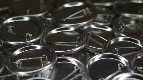 Pin badge button work piece on rotating table Stock Footage 88025785