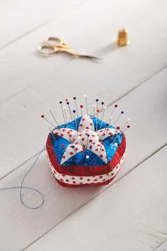 Pin cushion stylized elements of American flag, sewing accessories Stock Photos