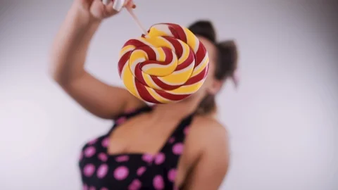 Pin-Up Girl Posing in Studio Stock Footage 124378185