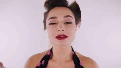 Pin-Up Girl Posing in Studio Stock Footage 124378239