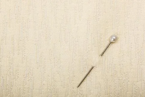 Pin inserted in fabric Stock Photos