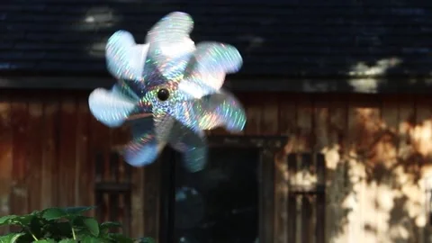 Pin Wheel Spinning In Breeze Back Yard Stock Footage 242594340