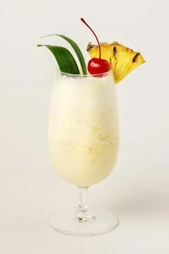Pina Colada with pineapple and cherry on top Stock Photos