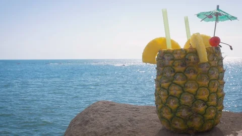 Piña Colada Served in a Fresh Pineapple at a Beach Resort in 4k Stock Footage 98270166