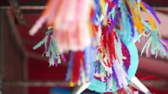 Mexican piñata hanging on a pole with a, Stock Video