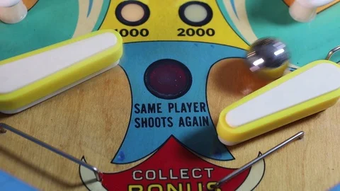 Pinball machine flippers handling a ball Stock Footage