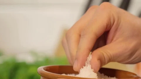 A pinch of salt close up defocussed kitchen background Stock-Footage 74605550