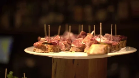 Pinchos of ham in a basque bar A bite of ham Sandwich of ham 動画素材 72411697