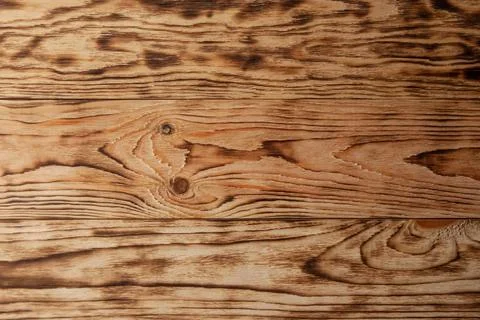 Pine boards after mechanical processing and firing. Wood texture close-up Stockfoto's