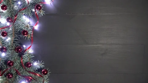 Pine branches adorned with red baubles red and shimmering lights Stock Footage 99057973