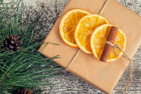 Pine branches, craft gift, dried oranges, cinnamon, top view instagram effect Stock Photos