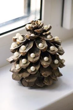 Pine cone in the form of a New Year tree. Christmas tree. Pine cone decorated Stock Photos