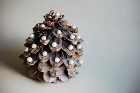 Pine cone in the form of a New Year tree. Christmas tree. Pine cone decorated Stock Photos