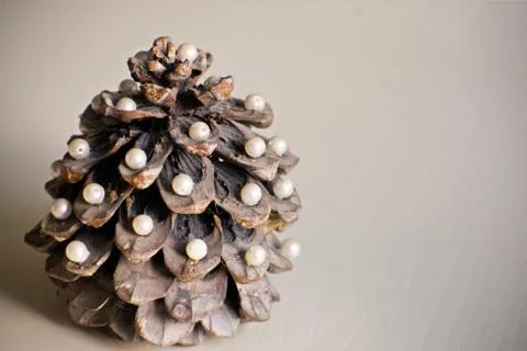 Pine cone in the form of a New Year tree. Christmas tree. Pine cone decorated Stock Photos