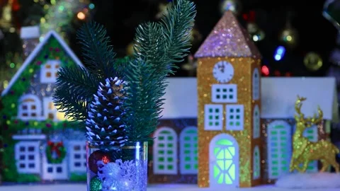 Pine cone small balls and Christmas tree branches rotate against the houses Stock Footage 288096454