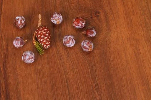 The pine cone on the wood Stock Photos