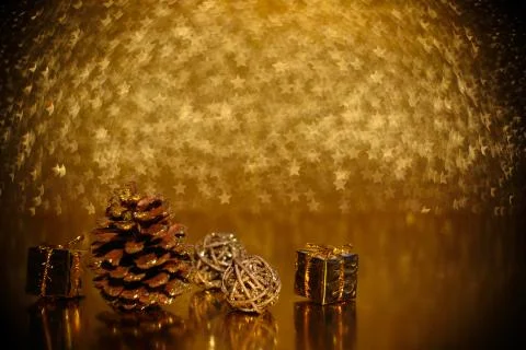 Pine cones on golden background Stock Photos