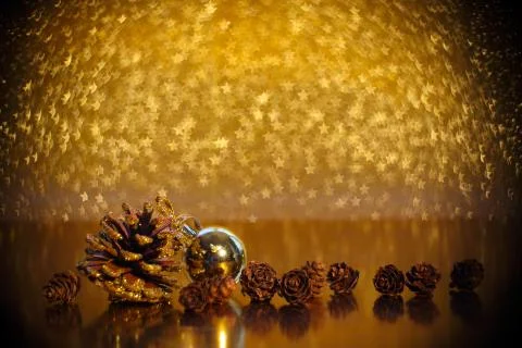 Pine cones on golden background 库存照片