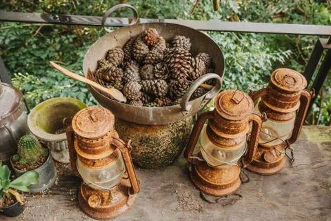 Pine cones in a rusty iron pan Ideas to decorate vintage style Stock Photos