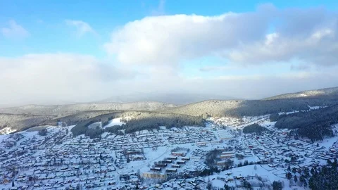 Pine forest, snow, mountains, blue sky, clouds, aerial photography Stock Footage 123757433
