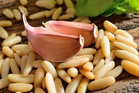 Pine nuts and garlic Stock Photos