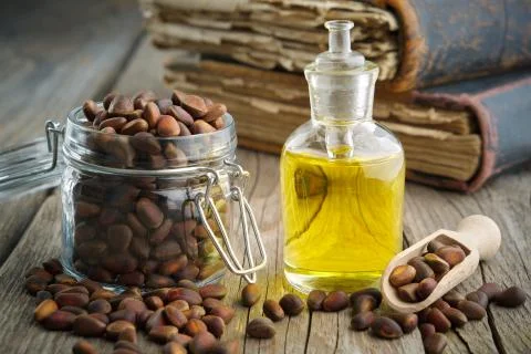 Pine nuts and pine nuts essential oil bottle. Foto stock