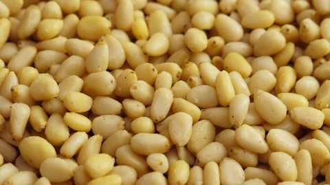 Pine nuts background. Unshelled cedar seeds, closeup Stock Footage 126016862