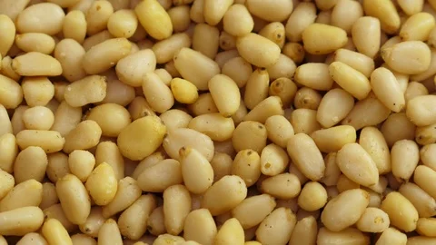 Pine nuts background. Unshelled cedar seeds, closeup Stock Footage 126016929