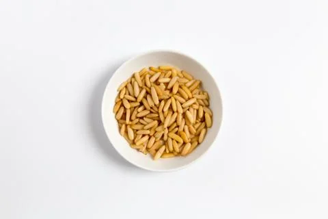 Pine nuts in a bowl as cut Stock Photos