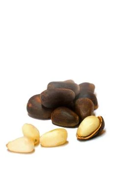 Pine nuts close and open Фото