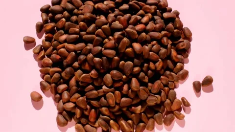 Pine nuts heap on a pink background. Stock Footage 172537274
