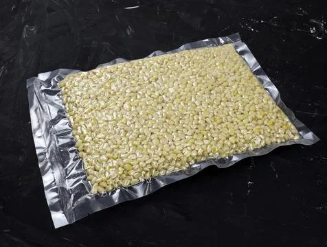 Pine nuts in a package closeup in vacuum packing Stock Photos