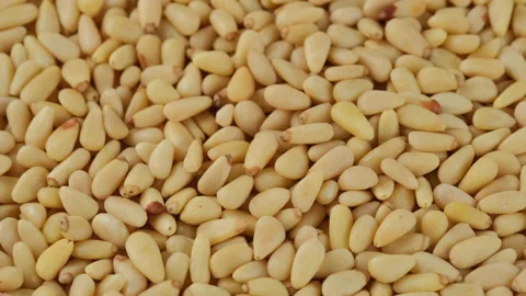 Pine nuts top view, rotation. Whole peeled pine nuts close up Stock Footage 198351432